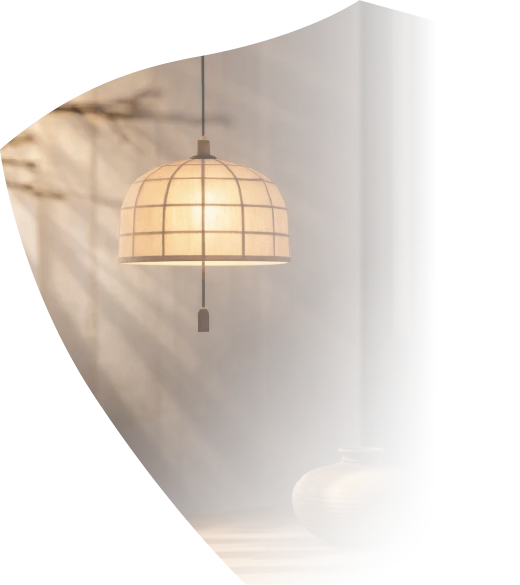 Kumiko pendant lamp in a quiet interior, framed by M Amaya's light-ray motif